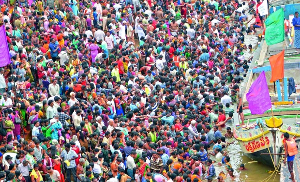 Heavy rush arrived: Devotees take a dip in the Godavari river at the Pushkar ghat as part of Maha Pushkaralu in Rajahmundry (Photo: DC) Heavy rush arrived: Devotees take a dip in the Godavari river at the Pushkar ghat as part of Maha Pushkaralu in Rajahmundry (Photo: DC)